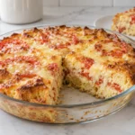 Savory Dutch Cupboard Cheese Pie with browned Swiss cheese, tomato slices, and toasted bread custard